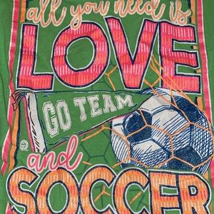 green and pink soccer tee